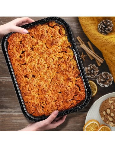 Rectangular cake pan with autumn baked cake and cinnamon