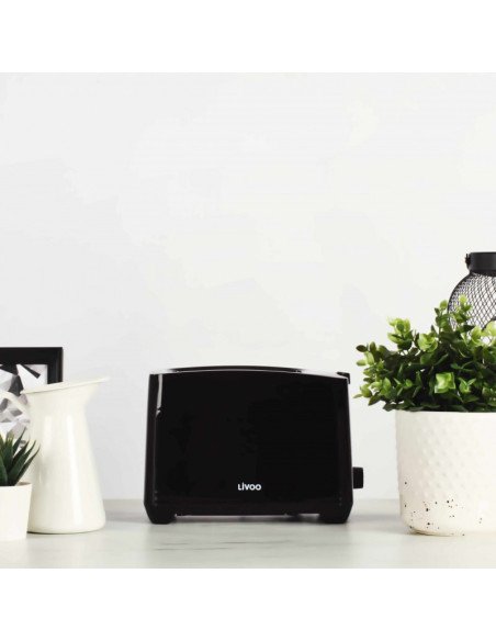 Livoo DOD162N black toaster on kitchen counter with plants