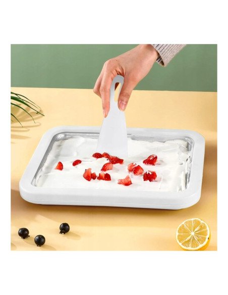 Rolled ice cream ready on the pan